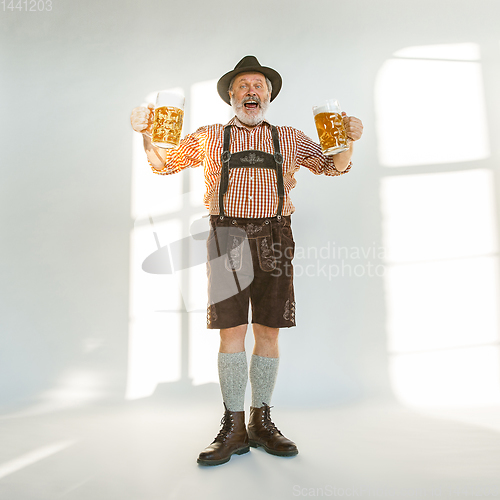 Image of Portrait of Oktoberfest man, wearing the traditional Bavarian clothes