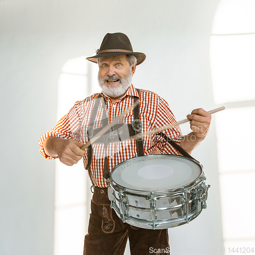 Image of Portrait of Oktoberfest man, wearing the traditional Bavarian clothes