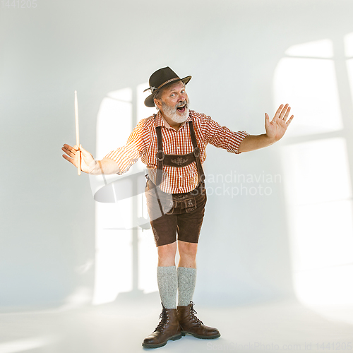 Image of Portrait of Oktoberfest man, wearing the traditional Bavarian clothes