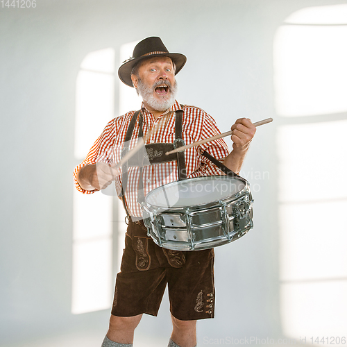 Image of Portrait of Oktoberfest man, wearing the traditional Bavarian clothes