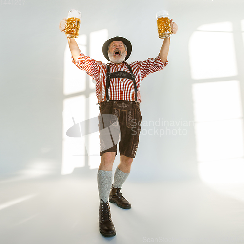 Image of Portrait of Oktoberfest man, wearing the traditional Bavarian clothes