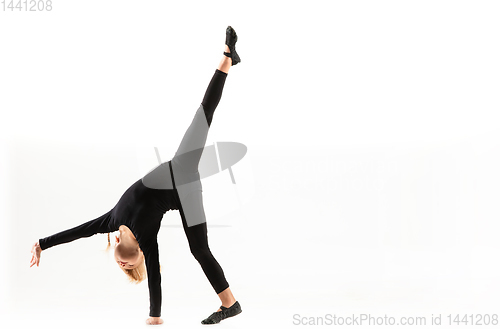 Image of Female little gymnast practicing isolated on white background