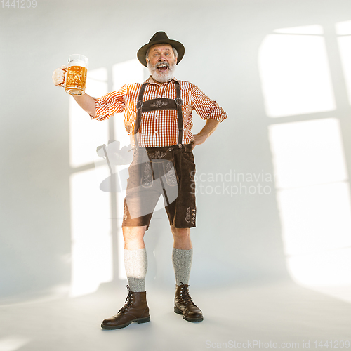 Image of Portrait of Oktoberfest man, wearing the traditional Bavarian clothes