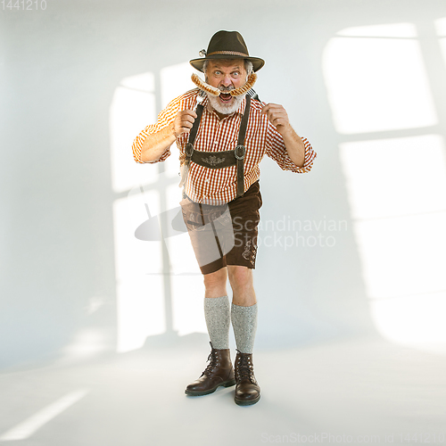 Image of Portrait of Oktoberfest man, wearing the traditional Bavarian clothes