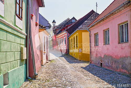 Image of Stone paved road and colorful houses