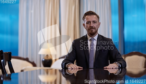 Image of Portrait of smiling ceo at modern office in stylish suit