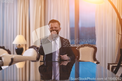 Image of business man wearing protective face mask at office