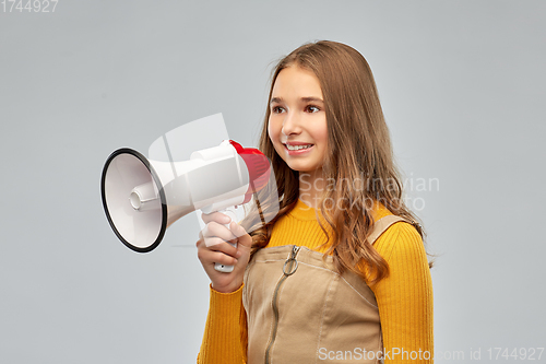 Image of smiling teenage girl speaking to megaphone