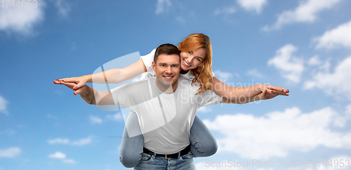 Image of happy couple in white t-shirts having fun