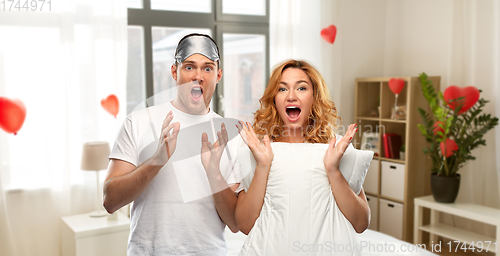 Image of scared couple with eye sleeping mask and pillow