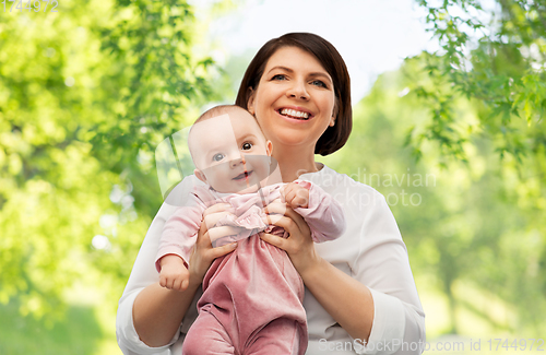 Image of happy middle-aged mother with little baby daughter