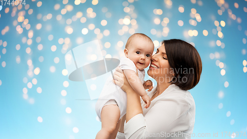 Image of happy middle-aged mother with little baby daughter