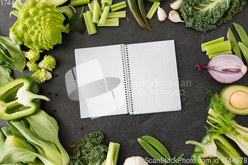 Image of green vegetables and diary with empty pages