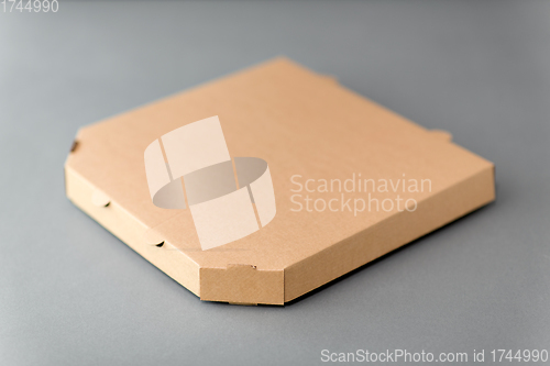 Image of takeaway food or pizza in brown paper box