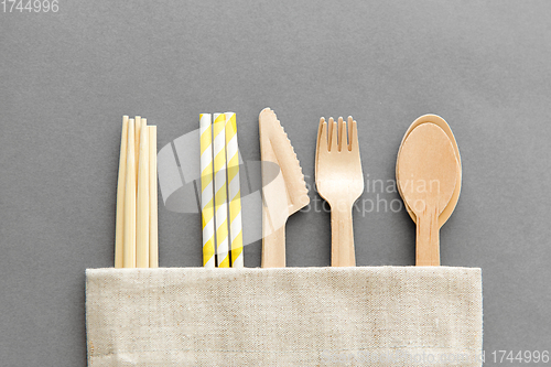 Image of wooden spoon, fork, knife, straws and chopsticks