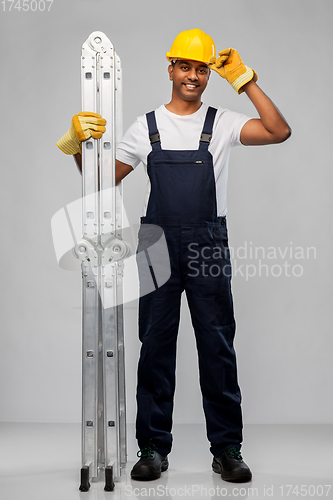 Image of happy indian builder in helmet with ladder