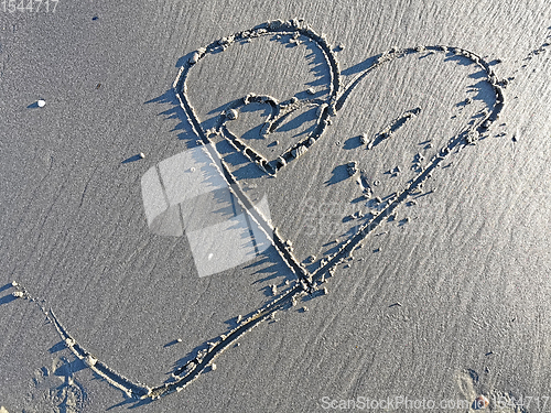Image of Love heart on sandy beach