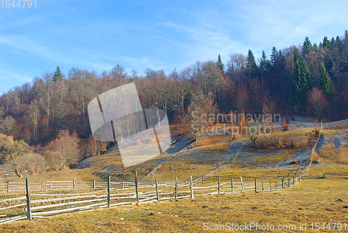 Image of Late autumn landscape , wood fences on meadow