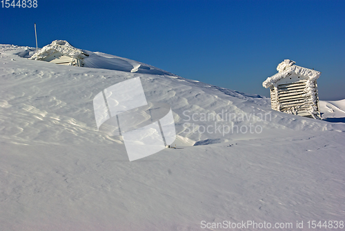 Image of Snow covered weather station on mountain top