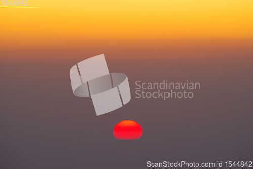 Image of Red sun appear at horizon