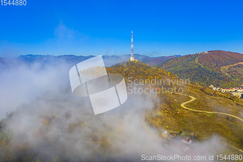 Image of Fog comming over antenna tower