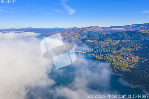 Image of Autumn fog cloud in mountain landscape