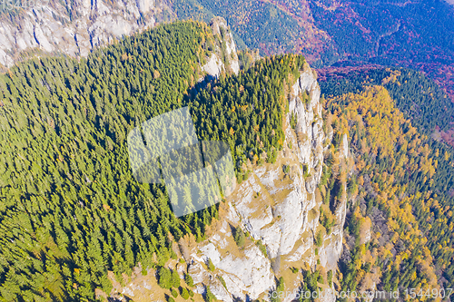 Image of Rock mountain and autumn forest viewed from above