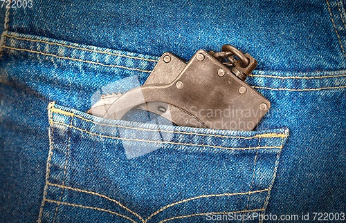 Image of Black metal handcuffs in back jeans pocket