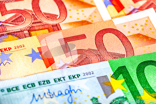 Image of Background from different euro banknotes close up