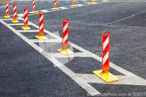 Image of Traffic safety. Traffic markings on a gray asphalt. Red and whit