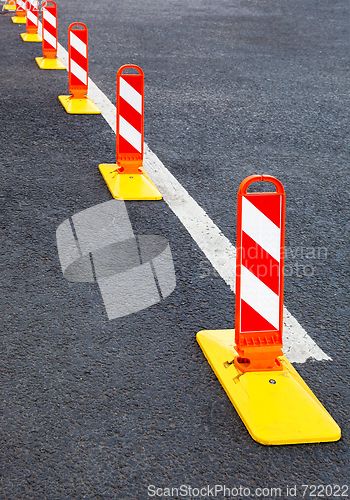 Image of Traffic safety. Traffic markings on a gray asphalt. Red and whit