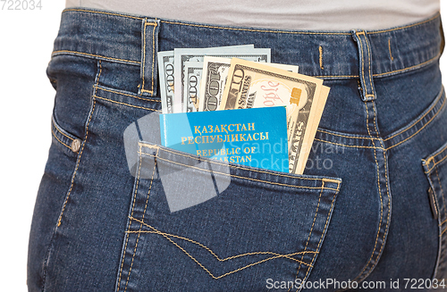 Image of Kazakhstan passport and dollar bills in the back jeans pocket. M