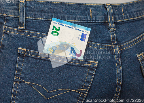 Image of Banknote 20 euro sticking out of the back jeans pocket. Money fo