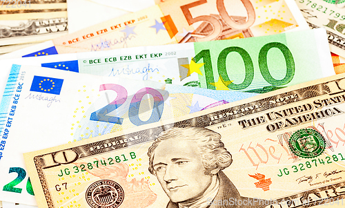 Image of Money background from american dollars and euro banknotes