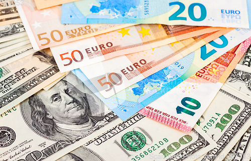 Image of Money background from euro banknotes and american dollars