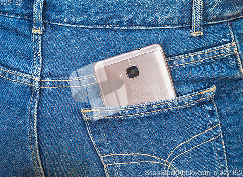 Image of Smartphone sticking out of the back jeans pocket