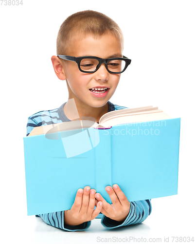 Image of Little boy is reading a book