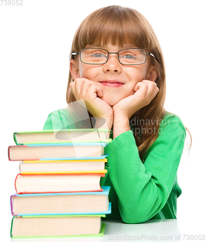 Image of Little girl is reading a book