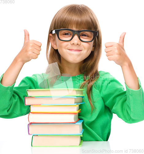 Image of Little girl is reading a book