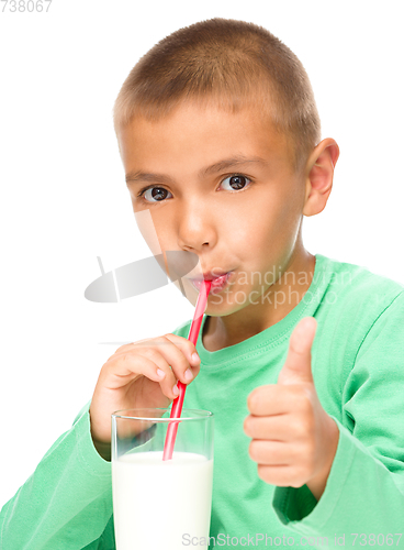 Image of Cute little boy with a glass of milk