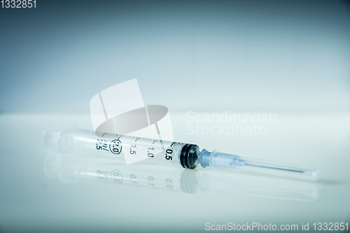 Image of Syringe on grey background