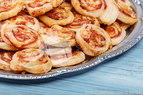 Image of homemade bacon snail like Hawaiian pizza