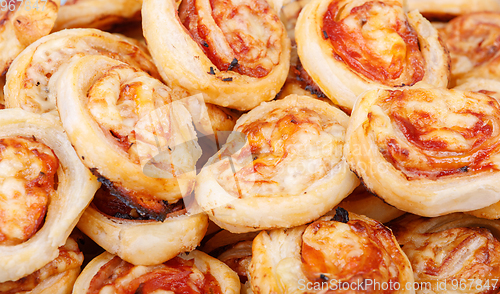 Image of homemade bacon snail like Hawaiian pizza