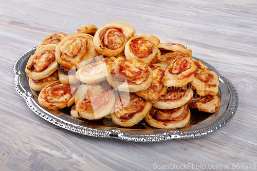 Image of homemade bacon snail like Hawaiian pizza