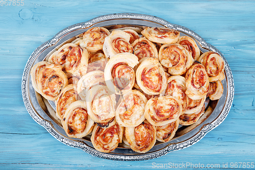 Image of homemade bacon snail like Hawaiian pizza