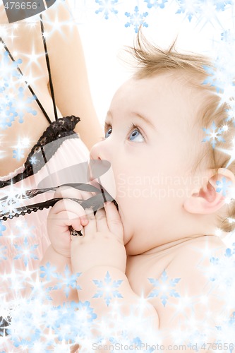 Image of clean baby boy in mother hands