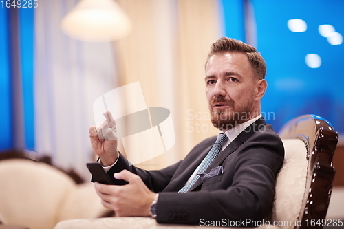 Image of Portrait of smiling ceo at modern office in stylish suit