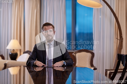 Image of business man using tablet computer