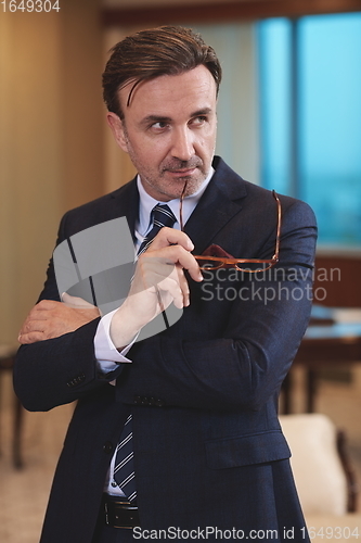 Image of Portrait of ceo at modern office in stylish suit