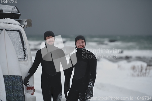 Image of Arctic surfers in wetsuit after surfing by minivan